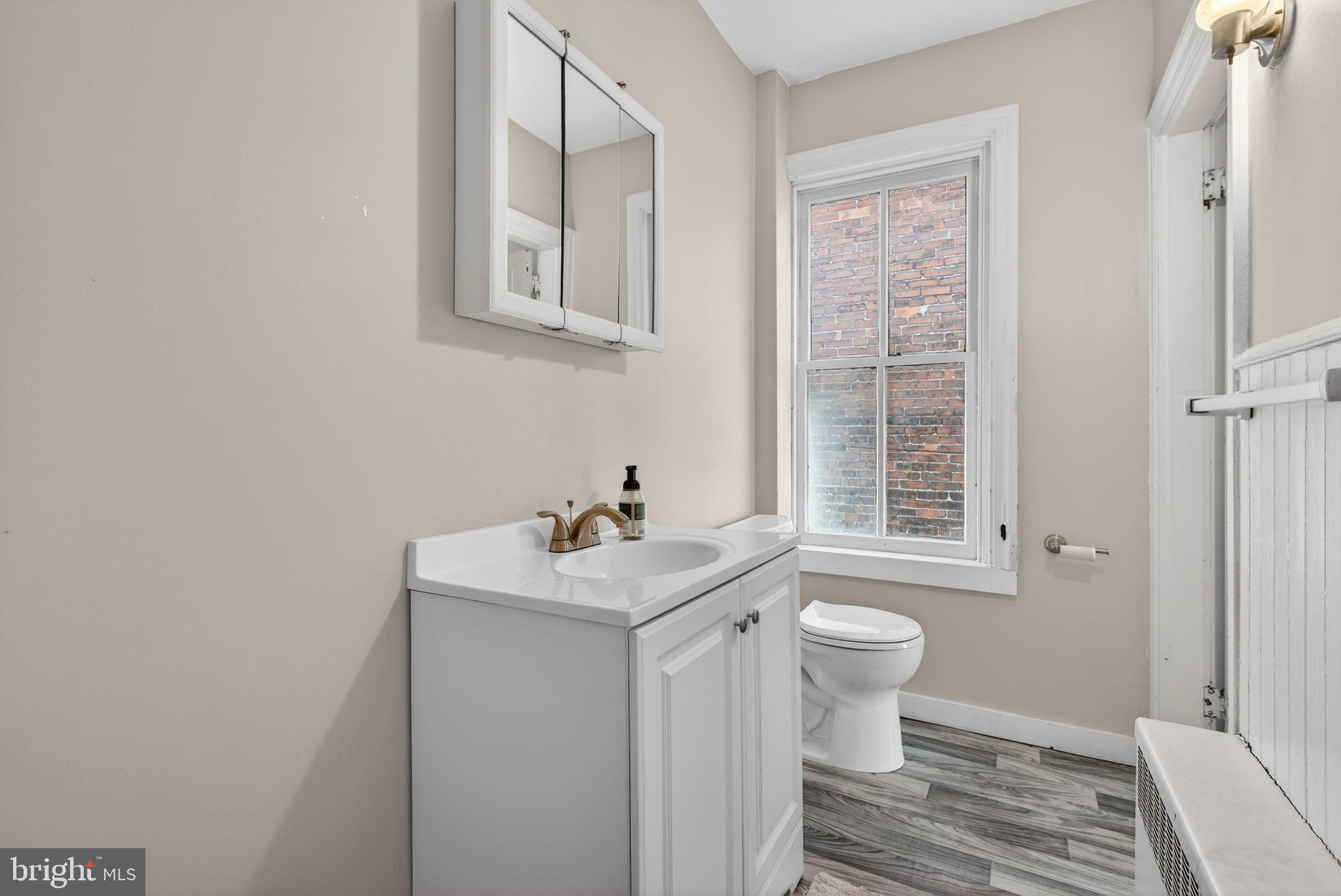 150 East Philadelphia Street York, PA 17401 - Photo 28 of 34 a bathroom with a sink toilet and window