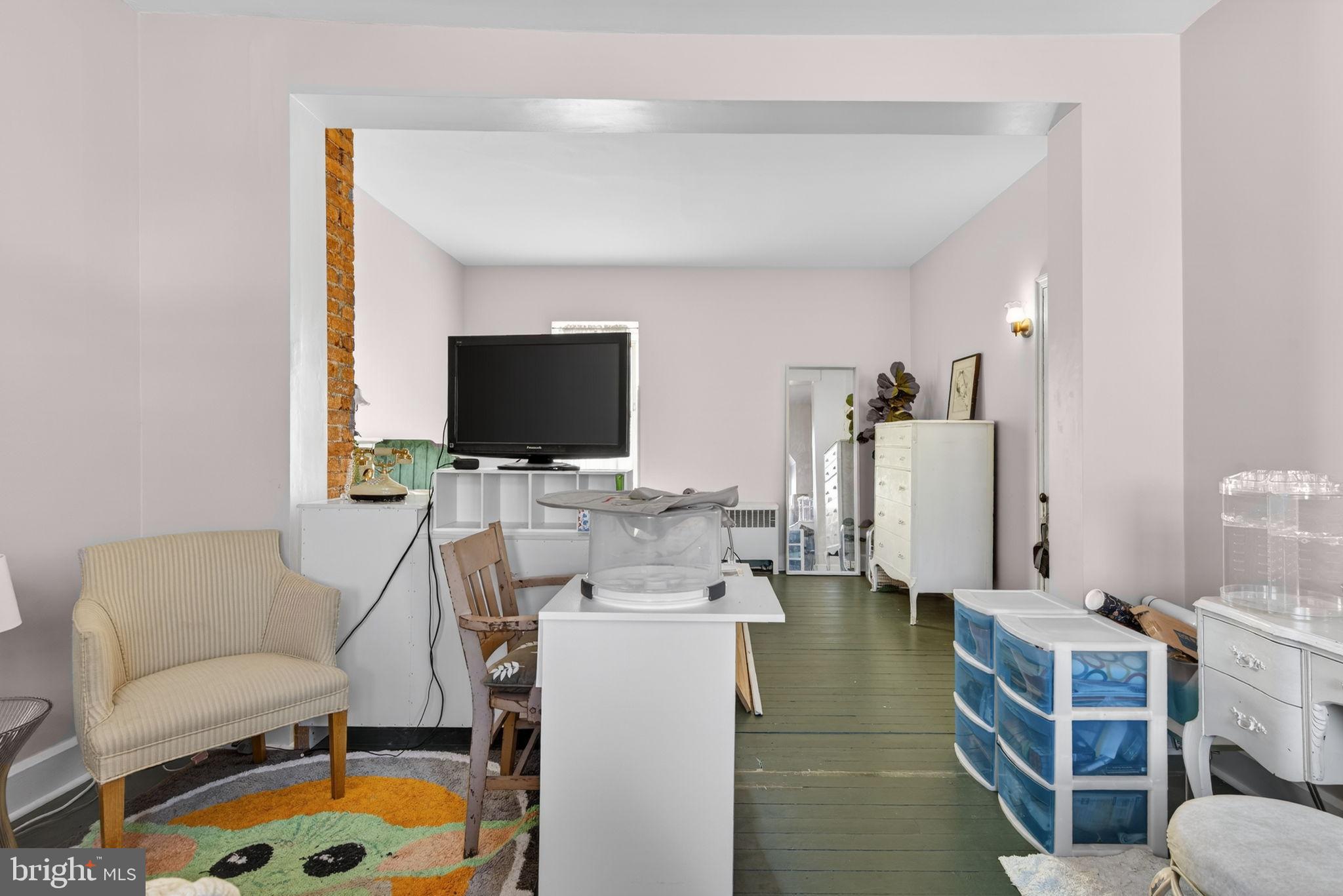 150 East Philadelphia Street York, PA 17401 - Photo 32 of 34 a living room with furniture and a flat screen tv