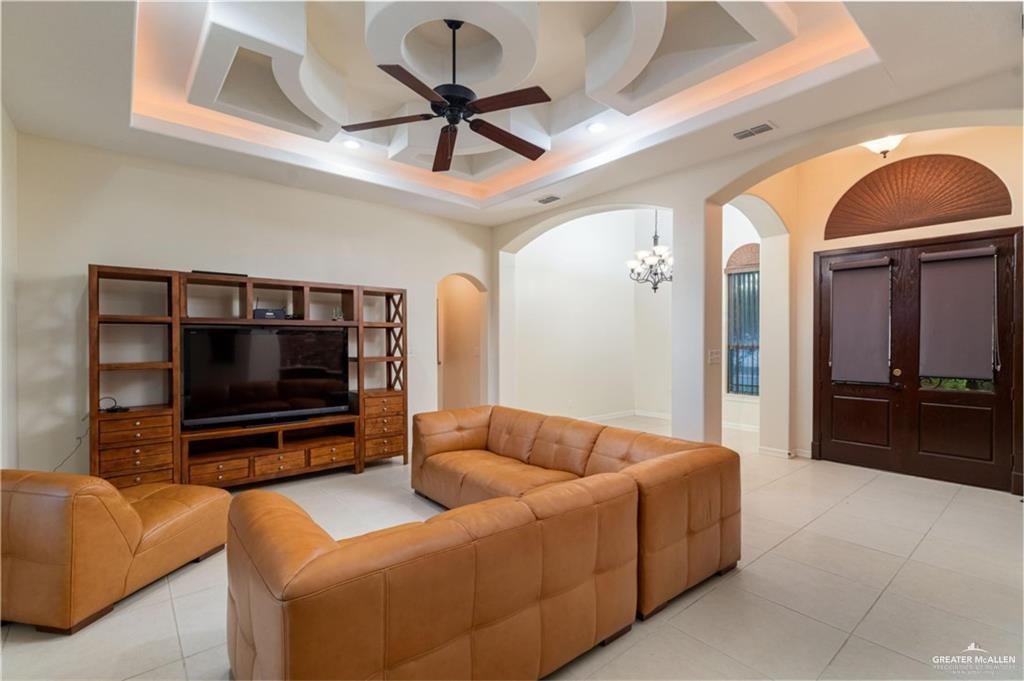 3210 South 5th Lane McAllen, TX 78503 - Photo 2 of 11 a living room with furniture and a flat screen tv