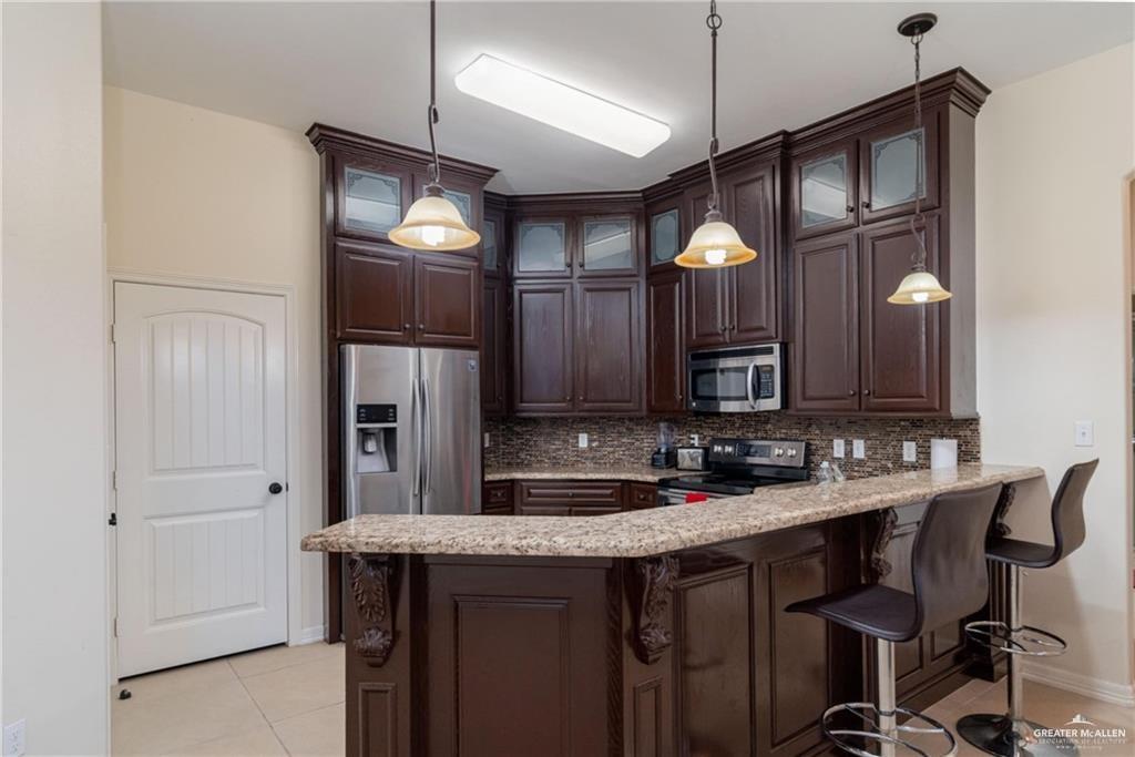 3210 South 5th Lane McAllen, TX 78503 - Photo 3 of 11 a bathroom with a sink vanity and a mirror