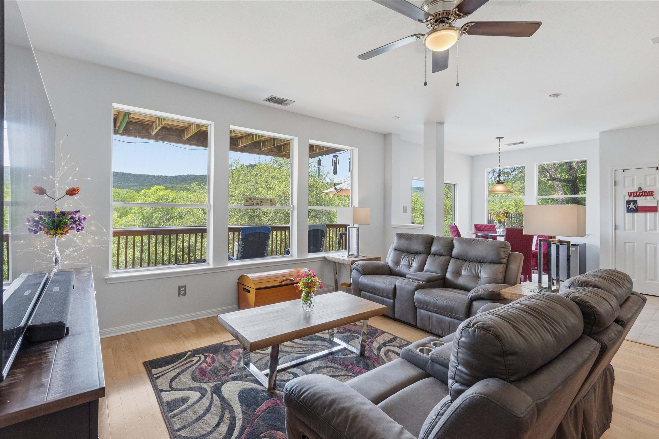 8122 Lime Creek Road Volente, TX 78641 - Photo 8 of 40 The family room with large windows that bring the fantastic view into the home
