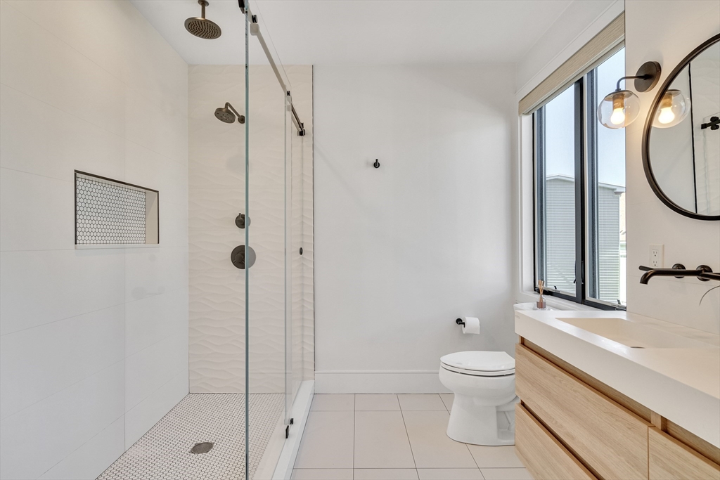 148 West 9th Street, Unit 6 Boston, MA 02127 - Photo 13 of 21 a bathroom with a toilet and a shower