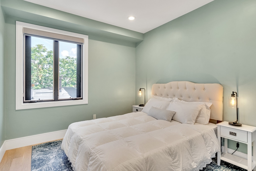 148 West 9th Street, Unit 6 Boston, MA 02127 - Photo 16 of 21 a bedroom with a bed and a window