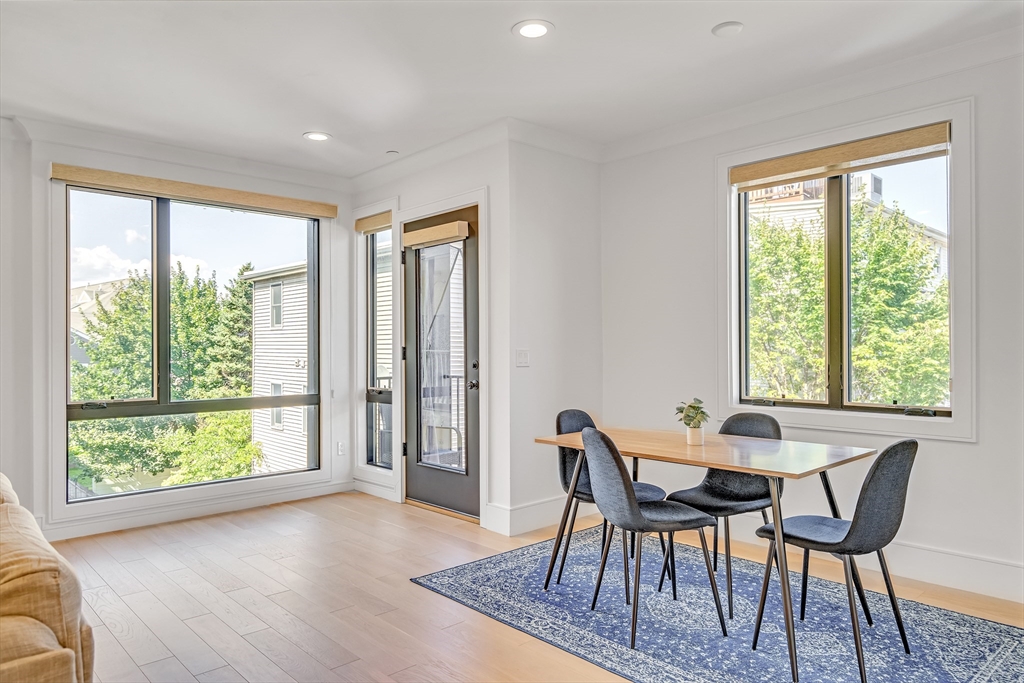 148 West 9th Street, Unit 6 Boston, MA 02127 - Photo 7 of 21 a view of a dining room with furniture and a window