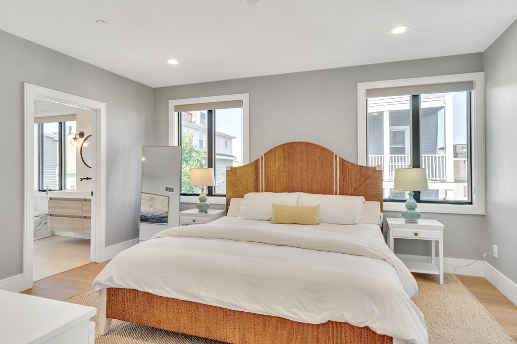 148 West 9th Street, Unit 6 Boston, MA 02127 - Photo 10 of 21 a bedroom with a large bed and a window