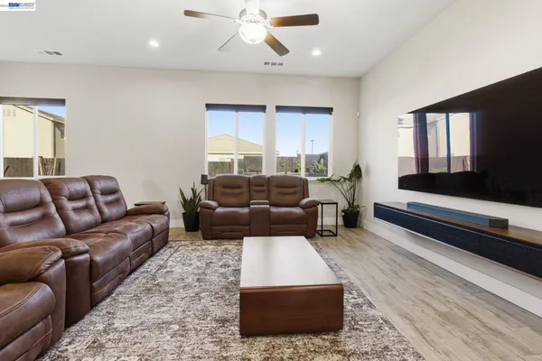 a view of a livingroom with furniture and a flat screen tv