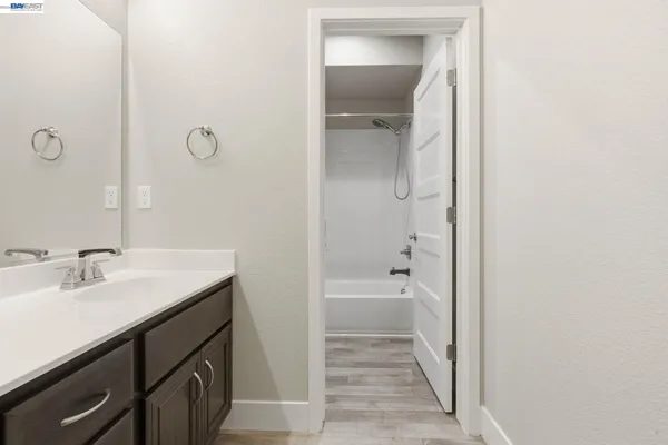 a view of a house with a big yard plants and large trees