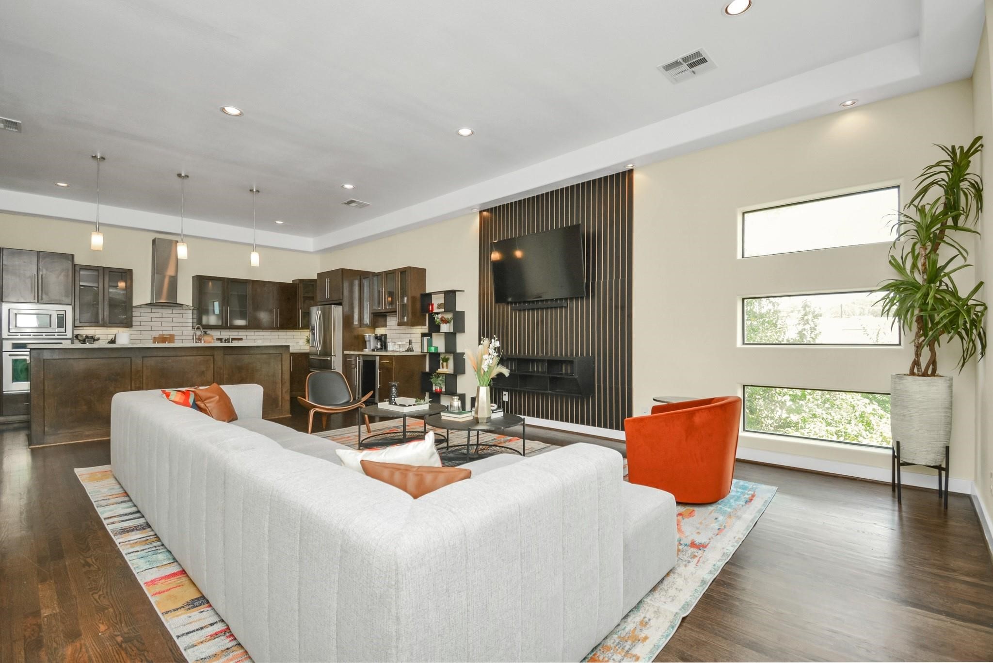 4608 Nett Street, Unit D Houston, TX 77007 - Photo 14 of 47 a living room with fireplace furniture and a wooden floor