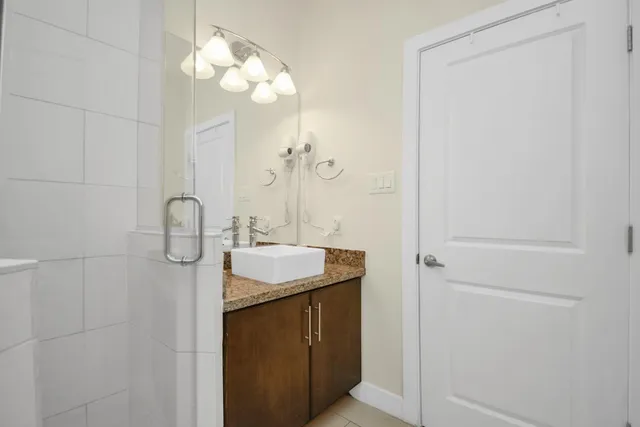 a bathroom with a sink and mirror