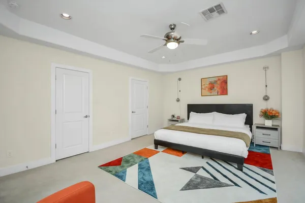 a bedroom with a bed and dresser