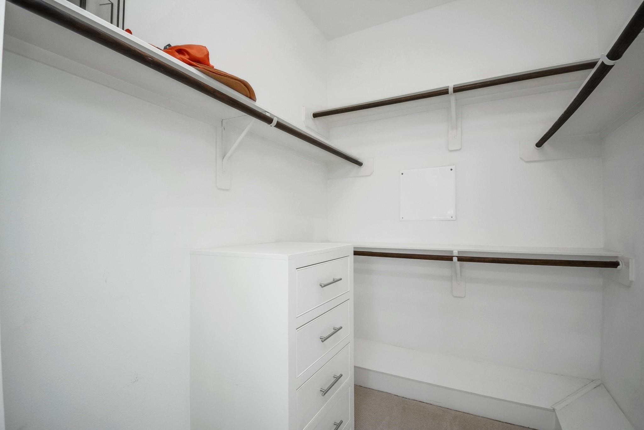 4608 Nett Street, Unit D Houston, TX 77007 - Photo 35 of 47 a view of walk in closet with empty racks