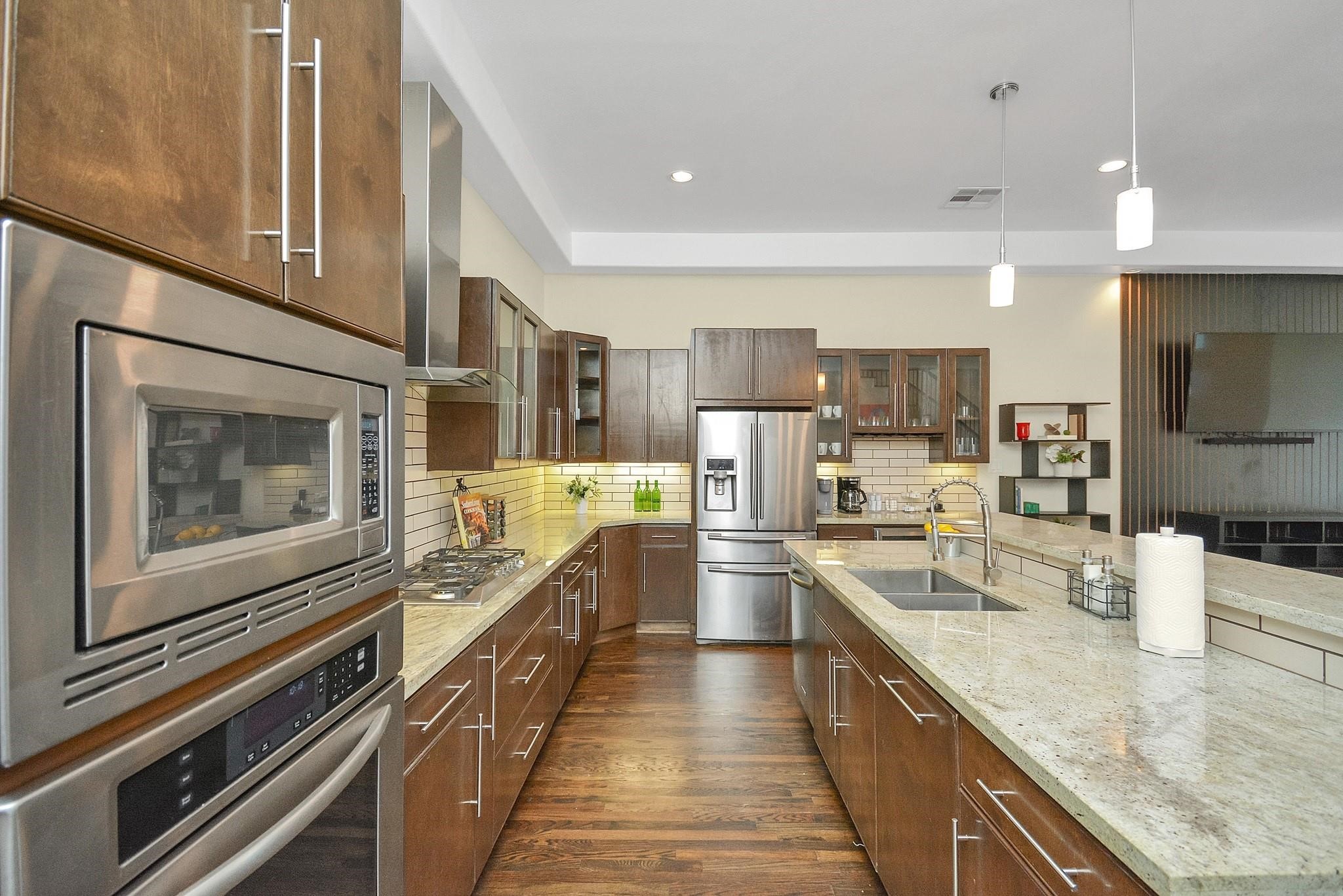 4608 Nett Street, Unit D Houston, TX 77007 - Photo 4 of 47 a large kitchen with a large counter top appliances and cabinets