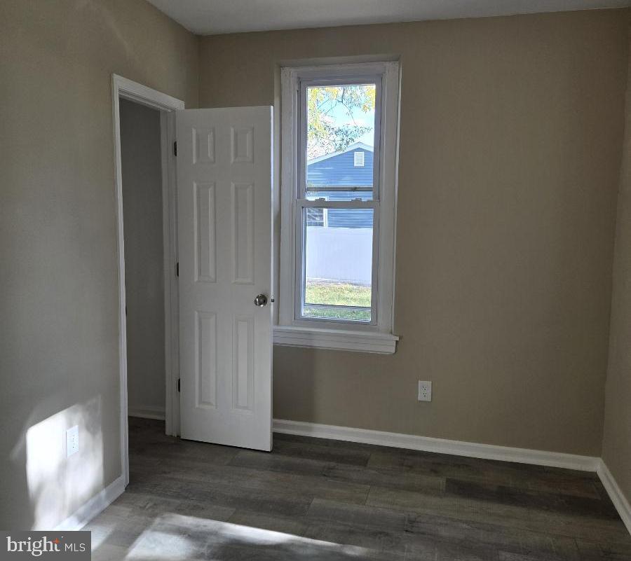 524 8th Avenue Lindenwold, NJ 08021 - Photo 12 of 22 an empty room with wooden floor and windows