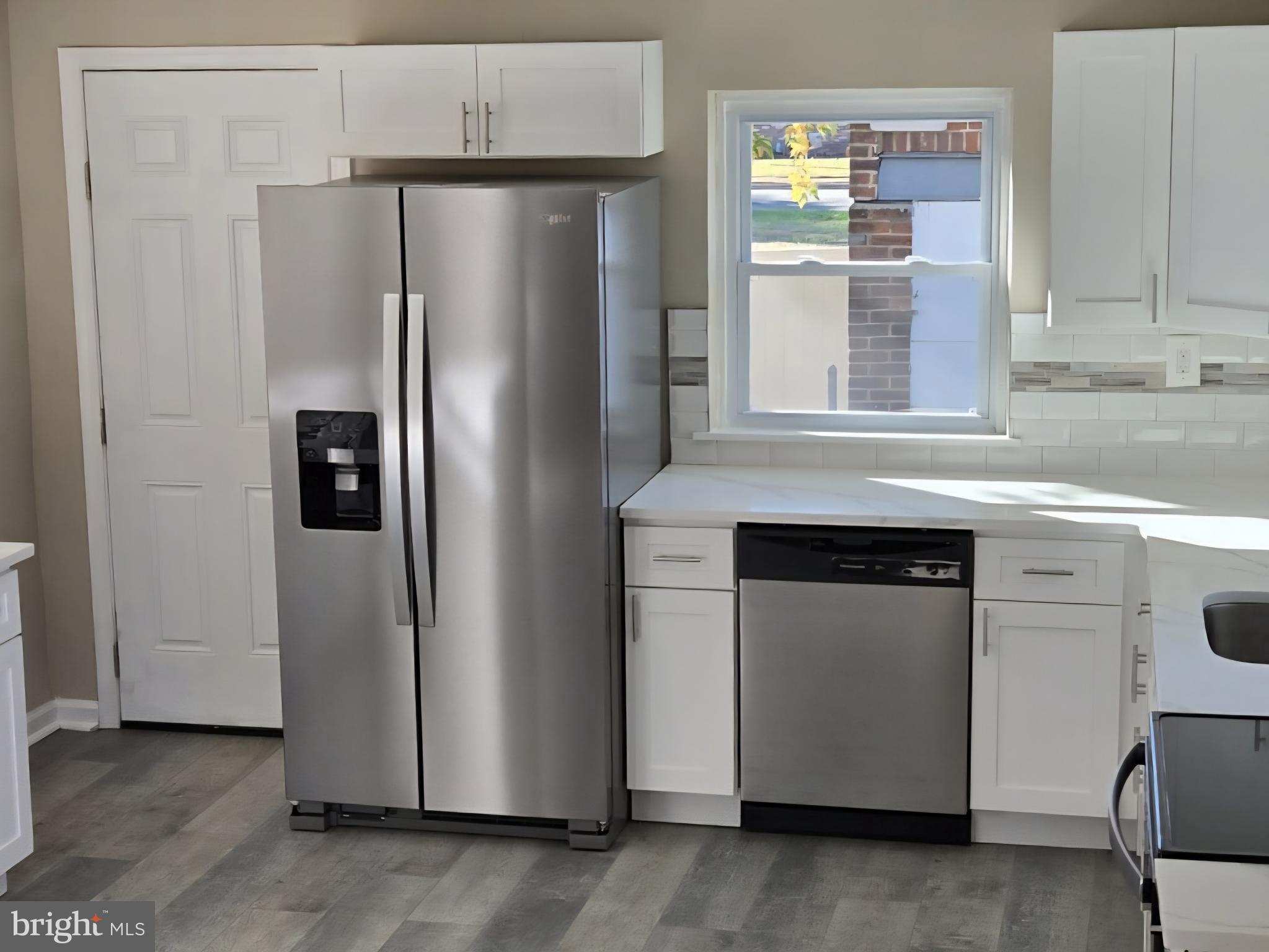 524 8th Avenue Lindenwold, NJ 08021 - Photo 10 of 22 a kitchen with stainless steel appliances granite countertop a refrigerator and a stove