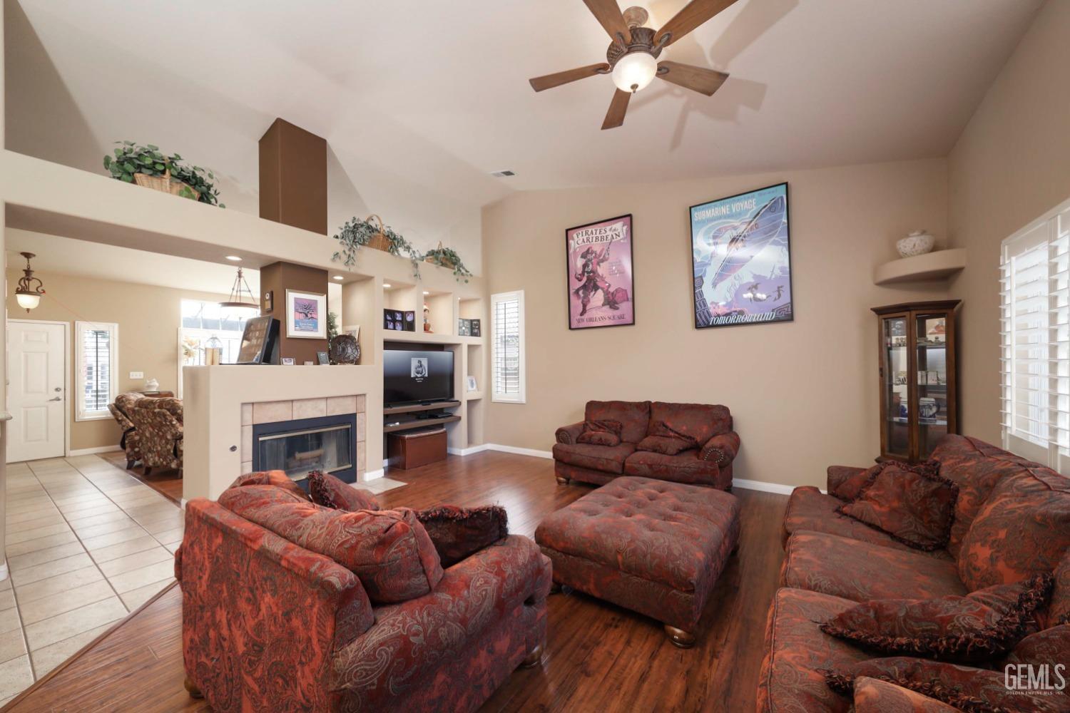 Undisclosed Address Bakersfield, CA 93312 - Photo 12 of 38 a living room with furniture and a fireplace