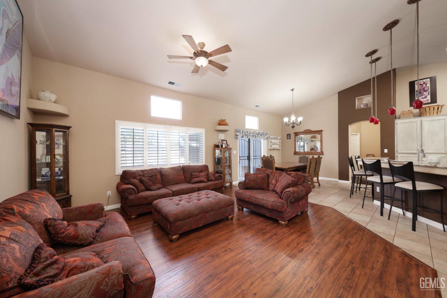 Undisclosed Address Bakersfield, CA 93312 - Photo 15 of 38 a living room with furniture and wooden floor