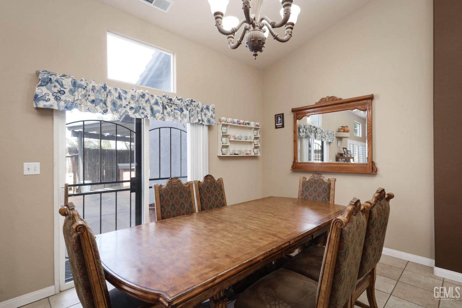 Undisclosed Address Bakersfield, CA 93312 - Photo 16 of 38 a view of a dining room with furniture
