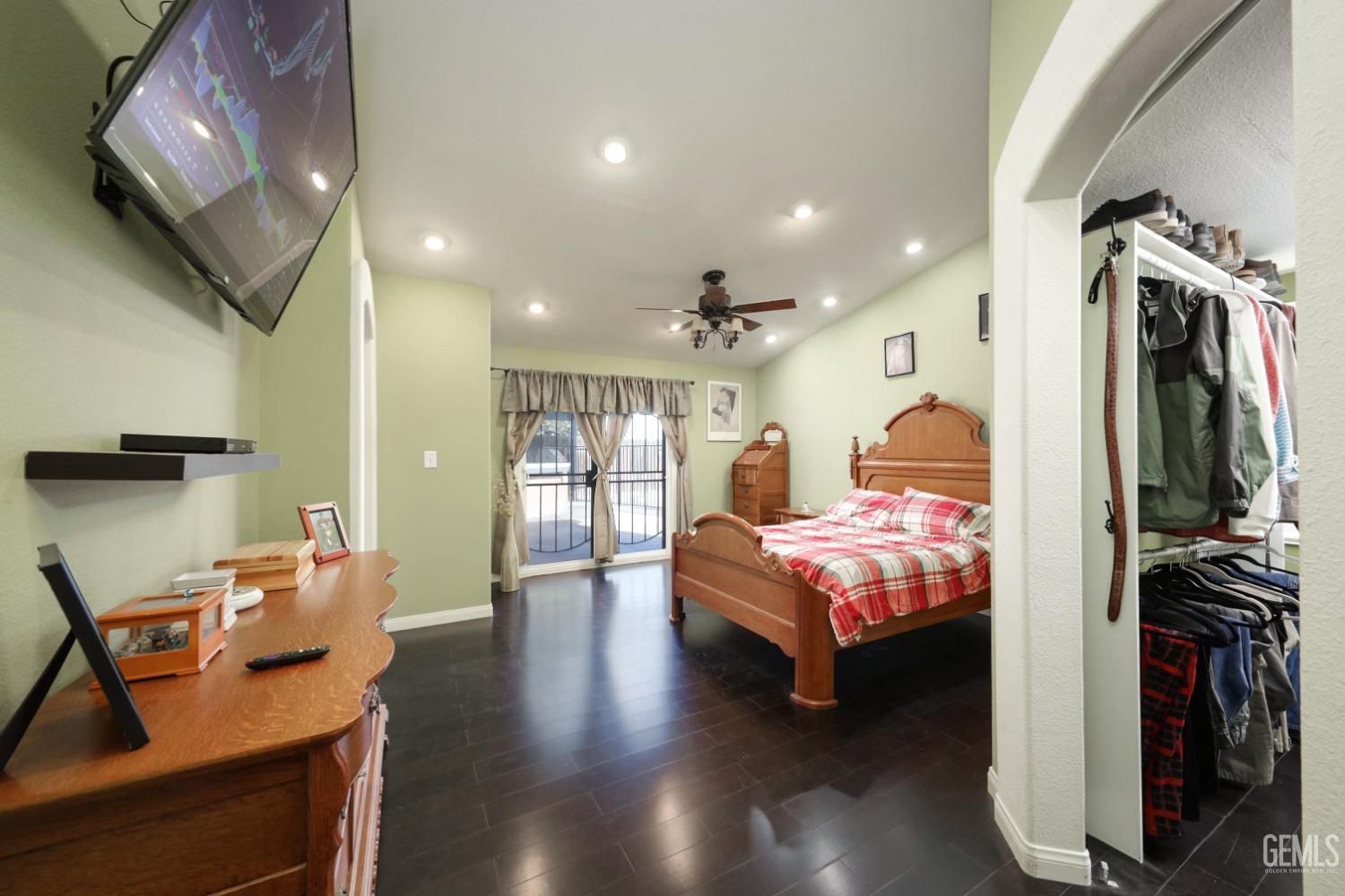 Undisclosed Address Bakersfield, CA 93312 - Photo 21 of 38 a living room with furniture and a flat screen tv