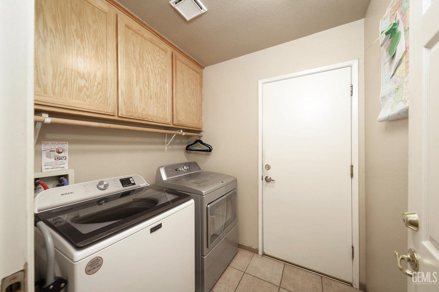Undisclosed Address Bakersfield, CA 93312 - Photo 34 of 38 a view of storage and utility room with washer and dryer