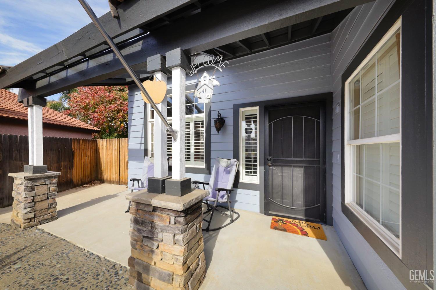 Undisclosed Address Bakersfield, CA 93312 - Photo 4 of 38 a living room with furniture and a fireplace