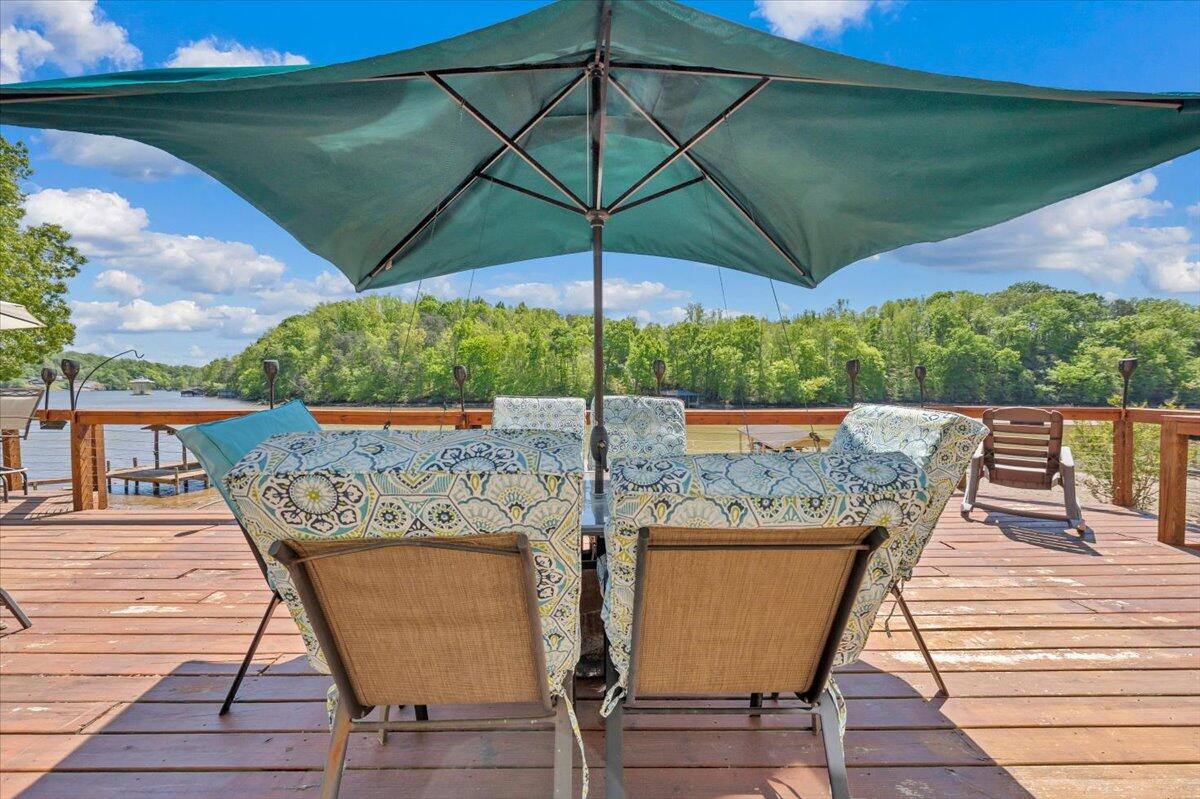swimming pool view with a seating space