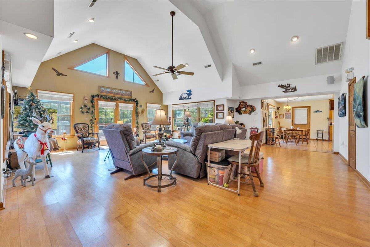 531 Brookwood Road Wirtz, VA 24184 - Photo 12 of 57 a living room with lots of furniture a wooden floor and chandelier