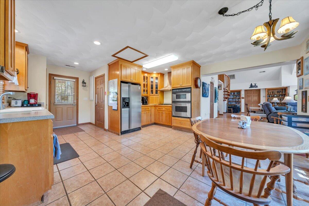 531 Brookwood Road Wirtz, VA 24184 - Photo 16 of 57 a living room with stainless steel appliances furniture a rug and a kitchen view