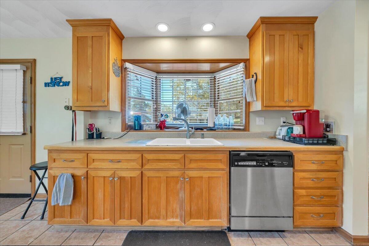 531 Brookwood Road Wirtz, VA 24184 - Photo 19 of 57 a kitchen with stainless steel appliances granite countertop a sink and a refrigerator