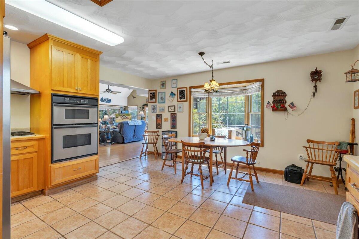 531 Brookwood Road Wirtz, VA 24184 - Photo 20 of 57 a view of a dining room with furniture window and outside view