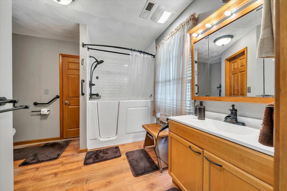 531 Brookwood Road Wirtz, VA 24184 - Photo 29 of 57 a bathroom with a sink mirror toilet and shower