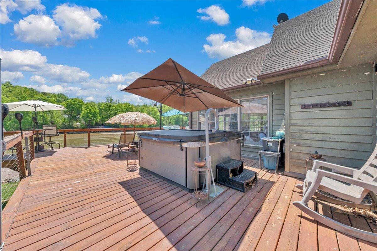531 Brookwood Road Wirtz, VA 24184 - Photo 44 of 57 a view of a roof deck with table and chairs barbeque with wooden floor