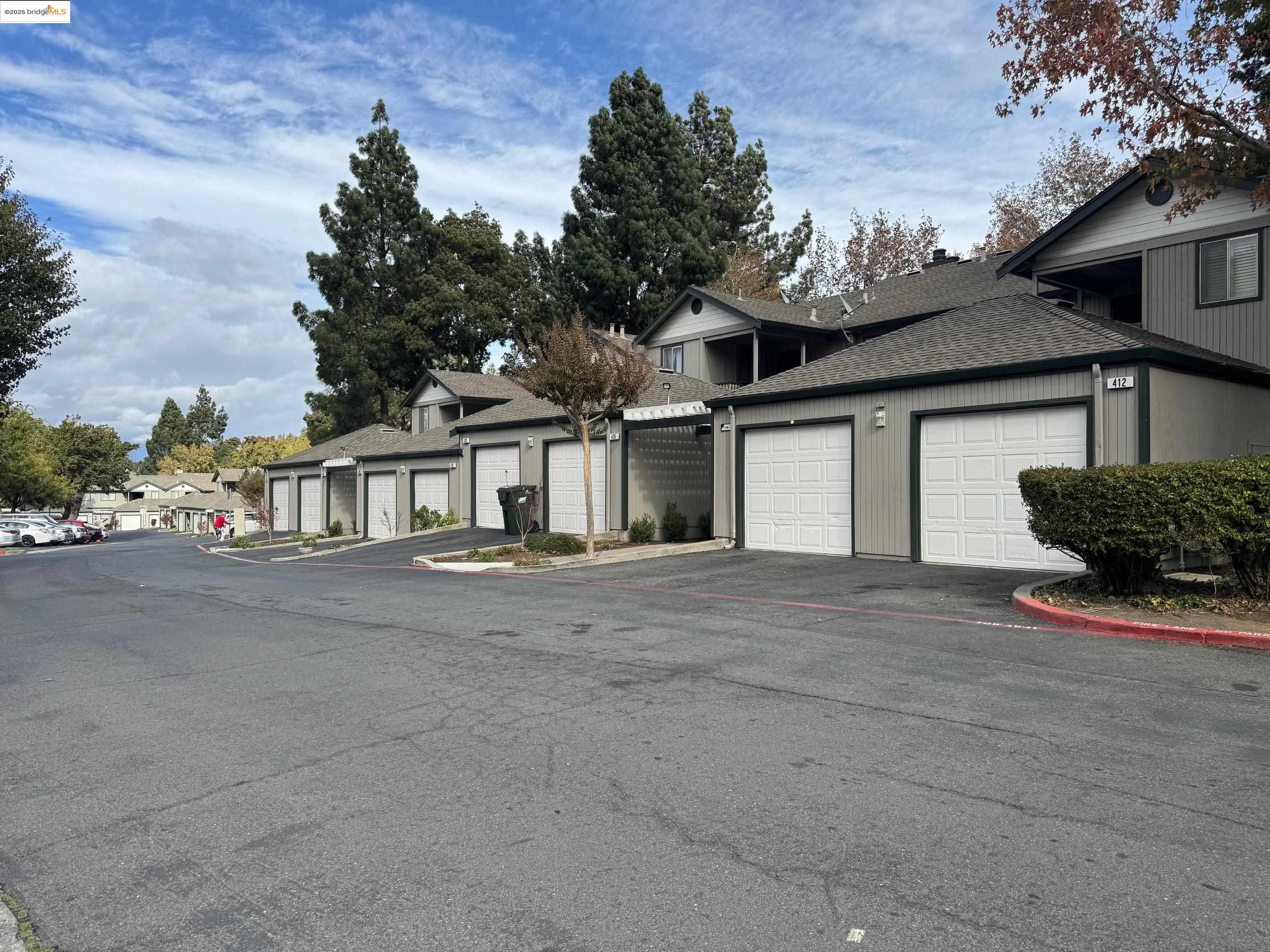 a view of a house with a outdoor space and parking