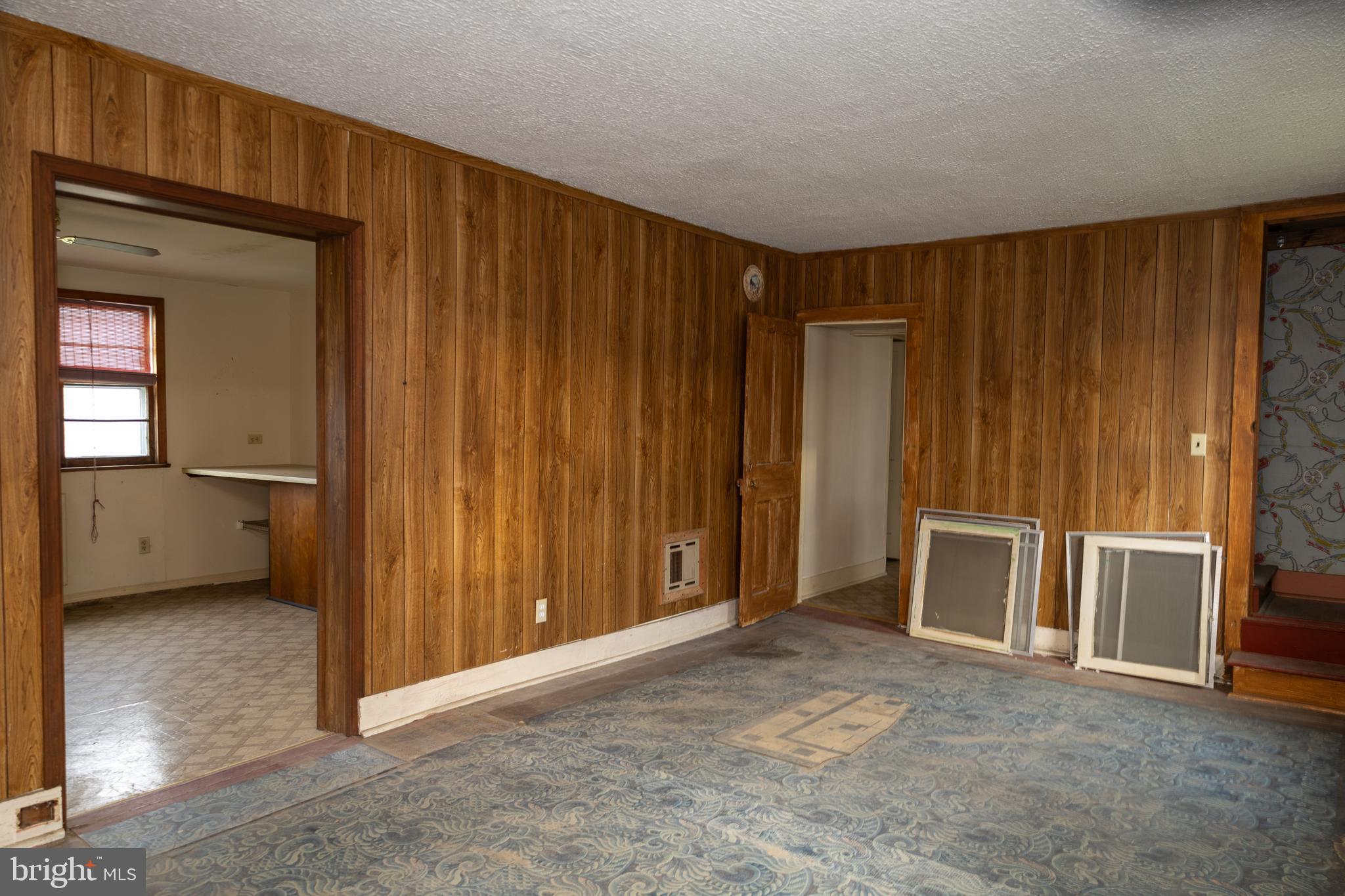 4398 South Bowers Road Milford, DE 19963 - Photo 16 of 54 a view of an empty room with a fireplace