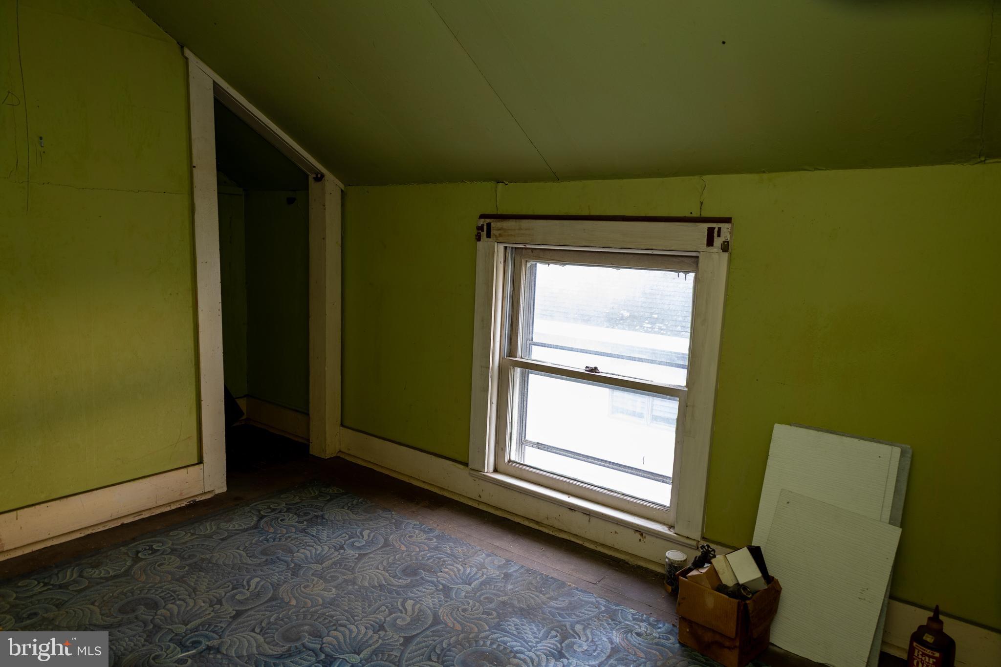 4398 South Bowers Road Milford, DE 19963 - Photo 25 of 54 a room with a window and a dresser