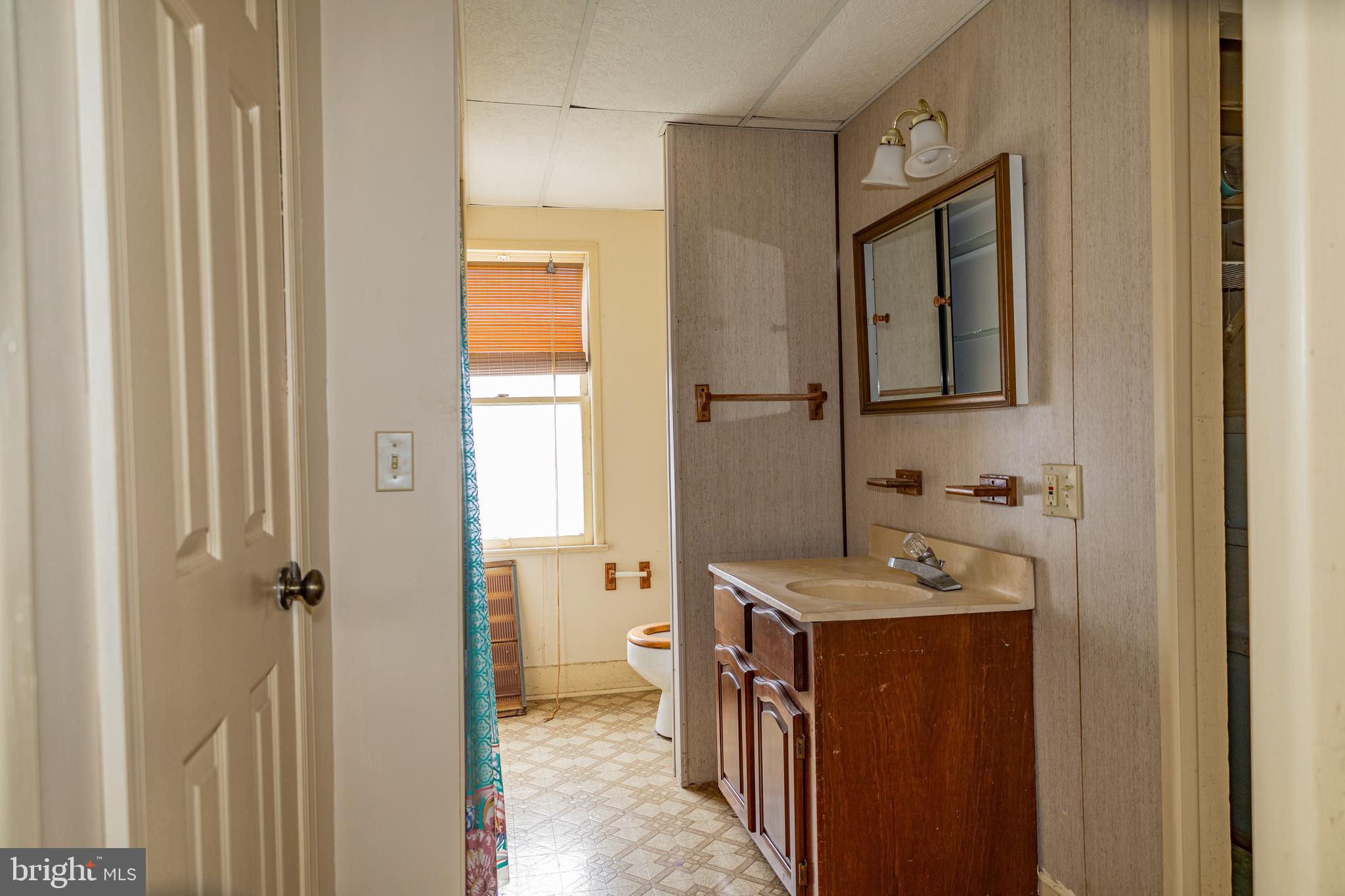 4398 South Bowers Road Milford, DE 19963 - Photo 29 of 54 a bathroom with a sink toilet and shower