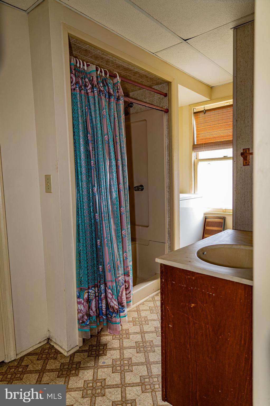 4398 South Bowers Road Milford, DE 19963 - Photo 30 of 54 a bathroom with a granite countertop sink and a mirror