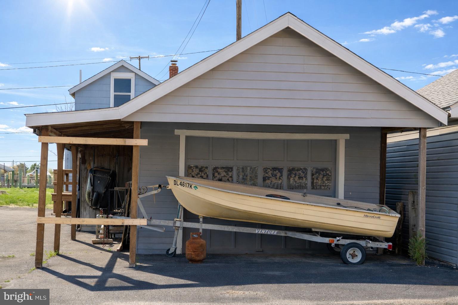 4398 South Bowers Road Milford, DE 19963 - Photo 8 of 54 a backyard of a house with seating space