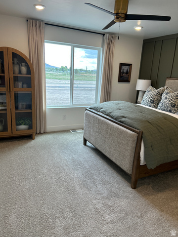 2011 West 1150 South, Unit 1042 Payson, UT 84651 - Photo 26 of 39 Photos are of model home.Spacious room featuring light gray carpet flooring, recessed lighting, and a contemporary ceiling fan with a brass-finish fixture
