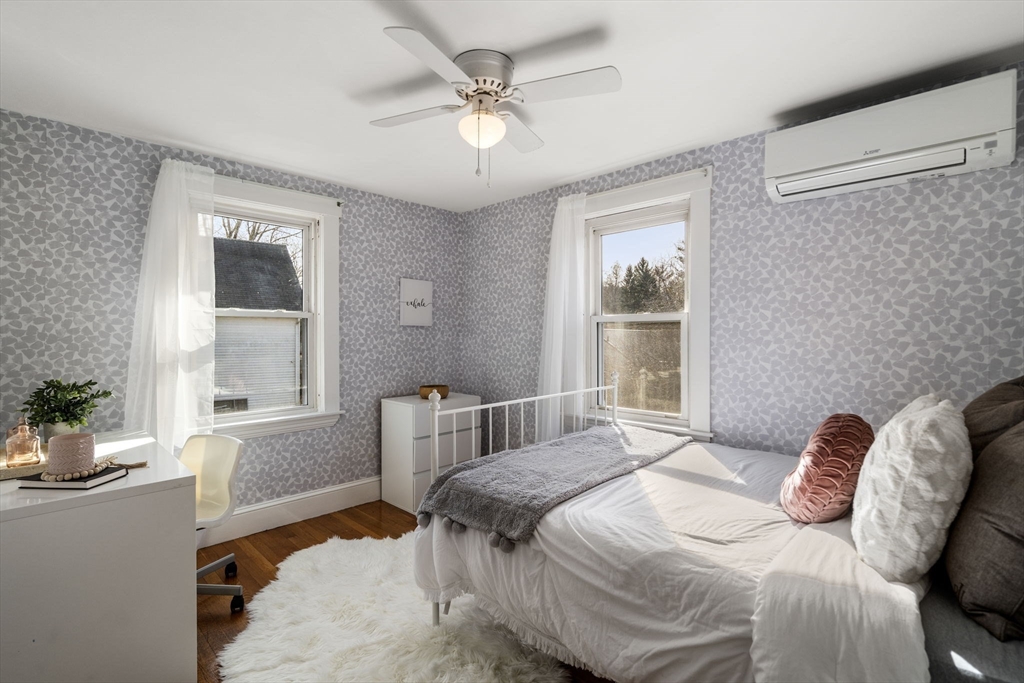 166 Hopedale Street Hopedale, MA 01747 - Photo 16 of 27 a bedroom with a bed and windows