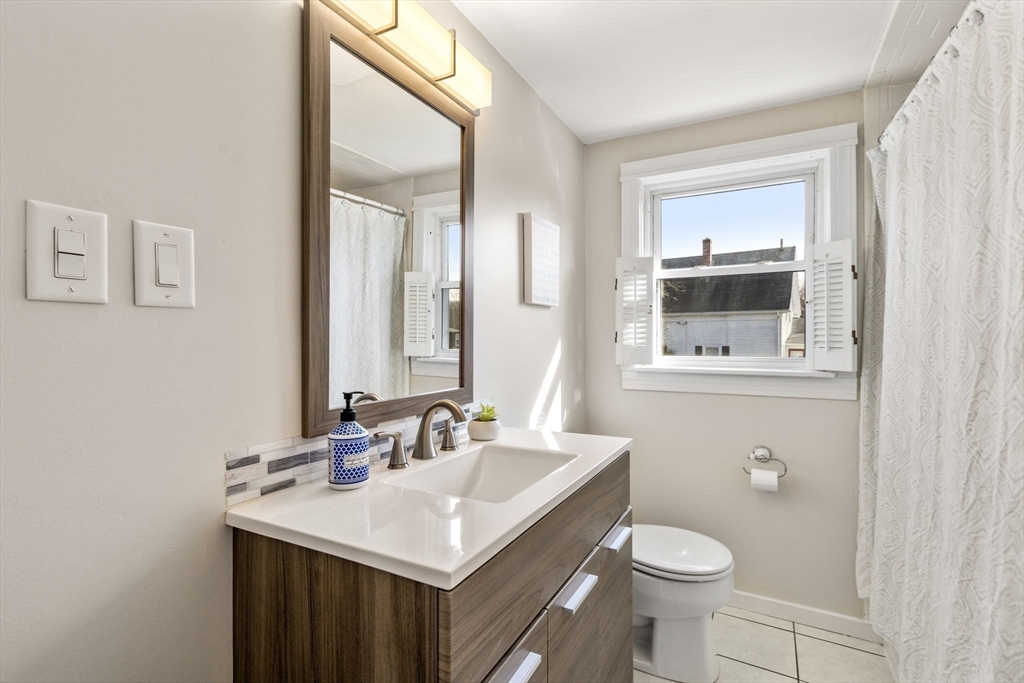 166 Hopedale Street Hopedale, MA 01747 - Photo 18 of 27 a bathroom with a sink a toilet and mirror
