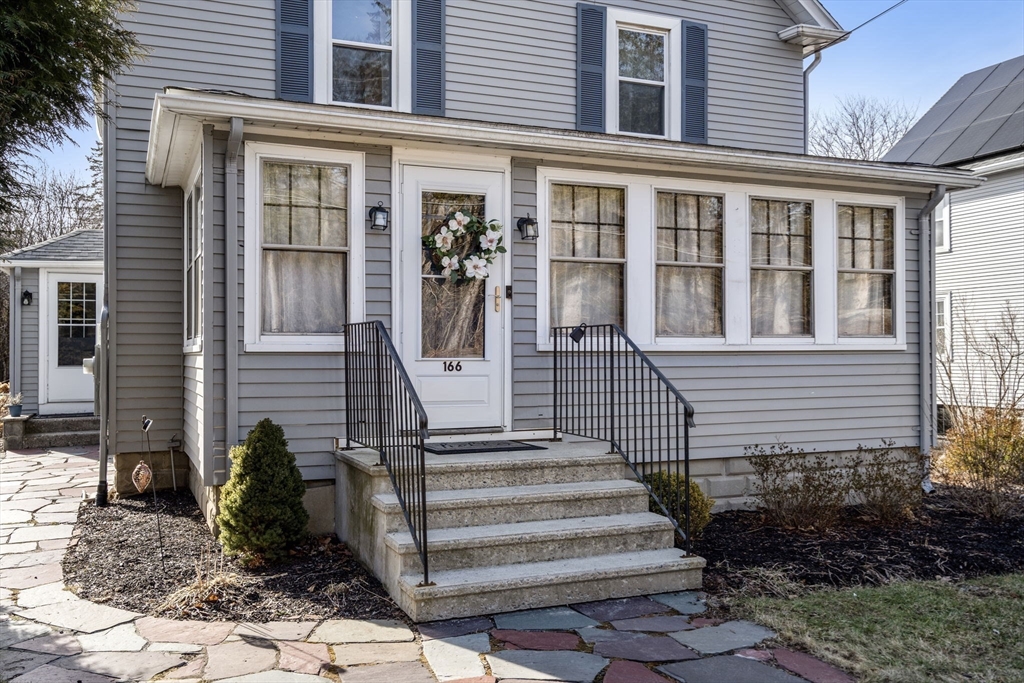 166 Hopedale Street Hopedale, MA 01747 - Photo 2 of 27 a view of a house with more windows and flower plants