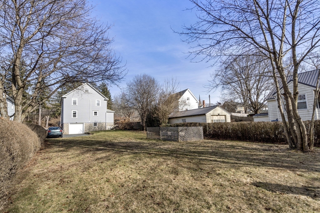 166 Hopedale Street Hopedale, MA 01747 - Photo 21 of 27 a front view of a house with a yard