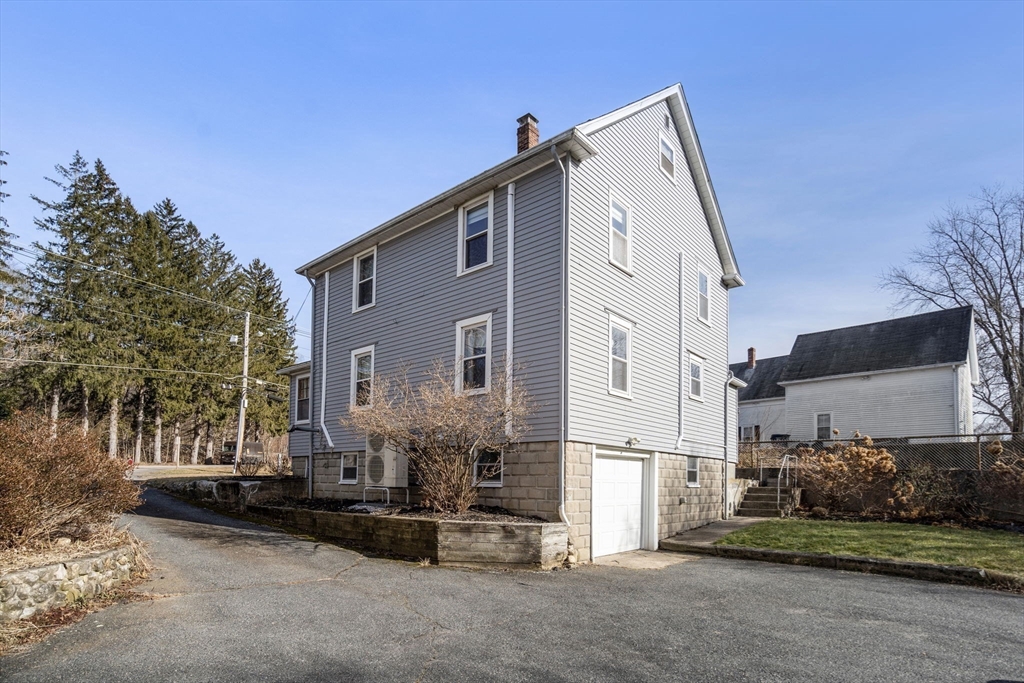 166 Hopedale Street Hopedale, MA 01747 - Photo 24 of 27 a front view of a house with a yard