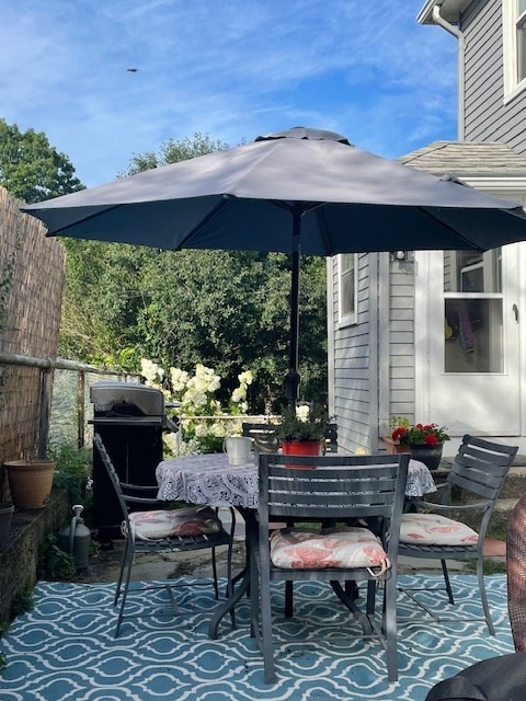 166 Hopedale Street Hopedale, MA 01747 - Photo 25 of 27 a backyard of a house with outdoor seating