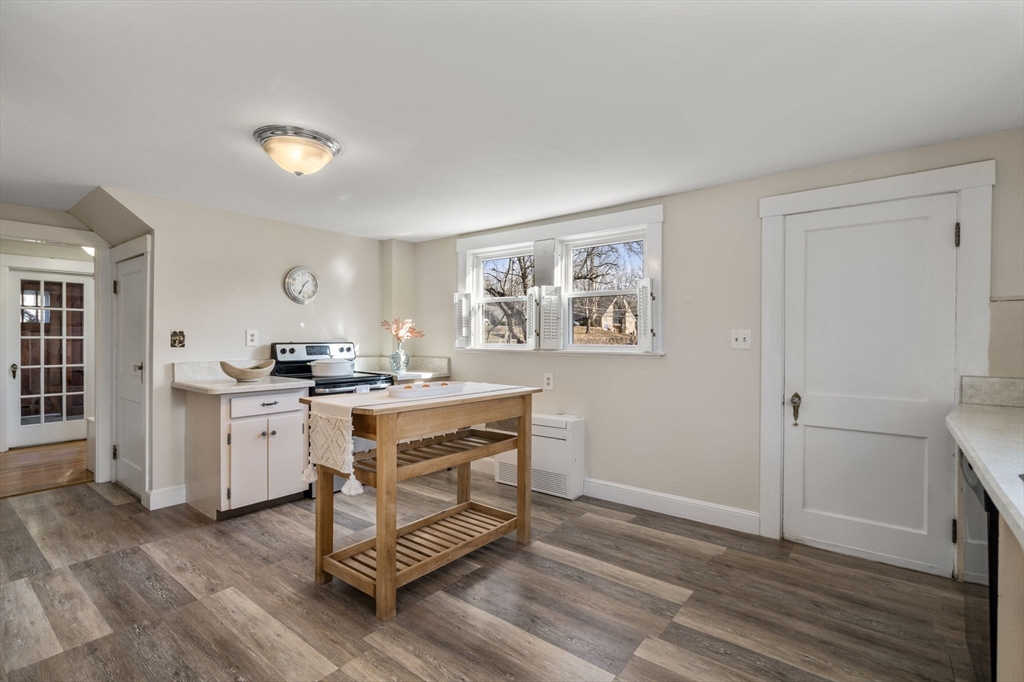 166 Hopedale Street Hopedale, MA 01747 - Photo 8 of 27 a kitchen with sink cabinets and wooden floor