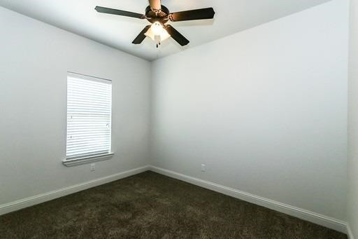 2518 111th Street, Unit A Lubbock, TX 79423 - Photo 10 of 14 an empty room with a window and a fan
