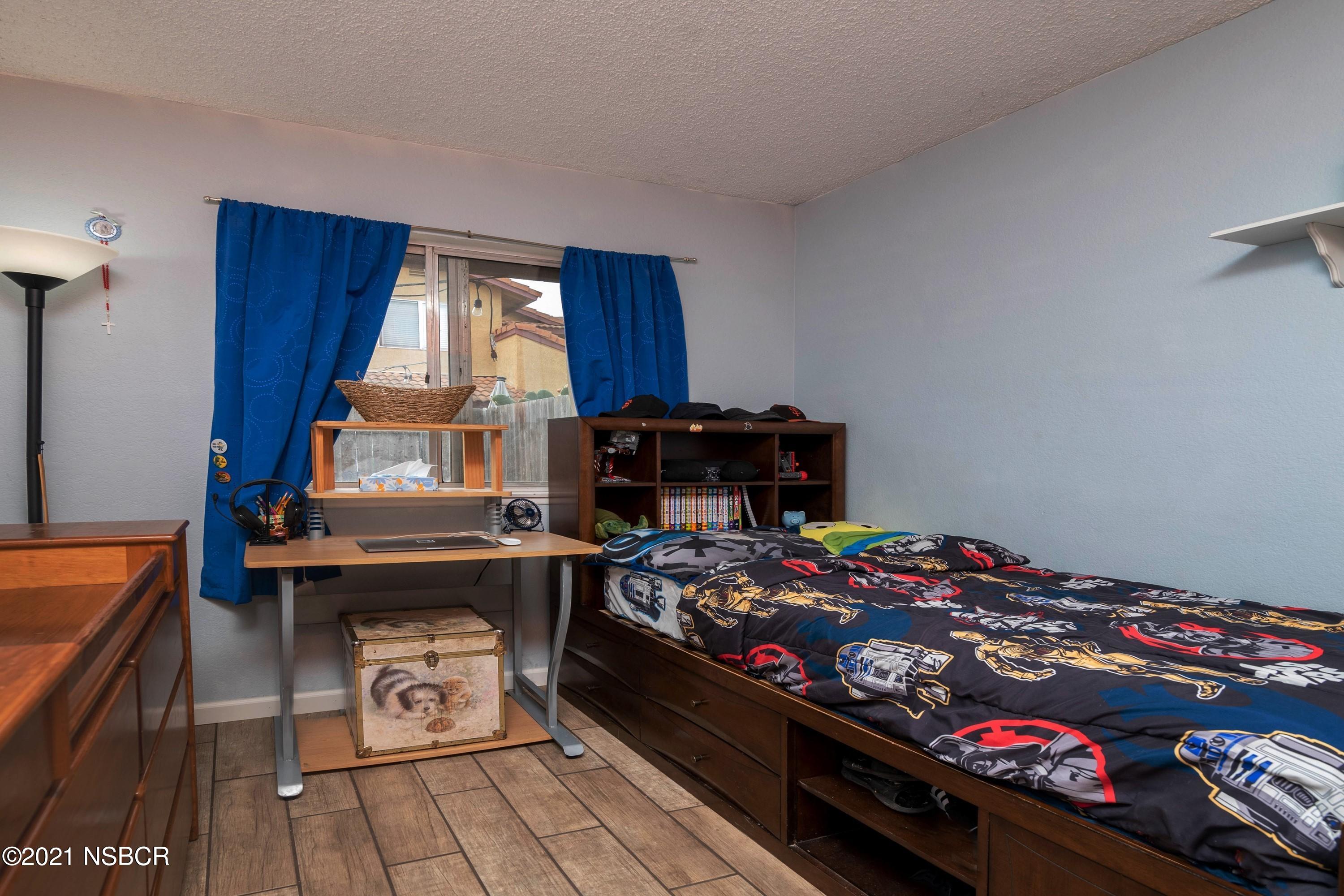 1117 Parkside Way Lompoc, CA 93436 - Photo 11 of 15 a bed room with a bed and a window