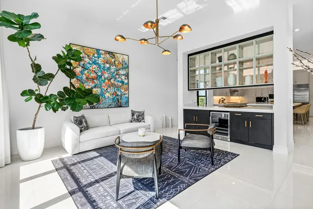 a bedroom with a bed tv and a large window