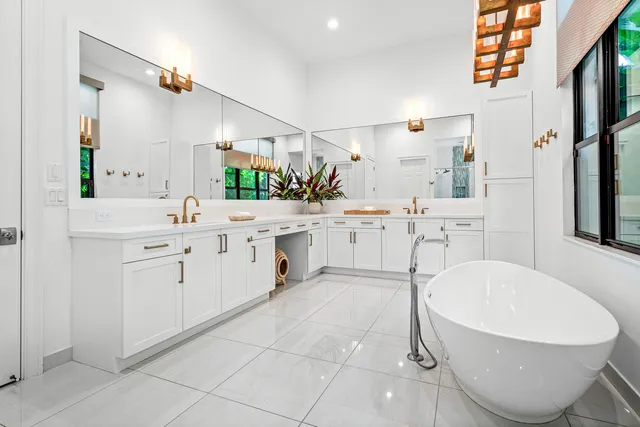 a bathroom with a granite countertop sink a toilet and shower