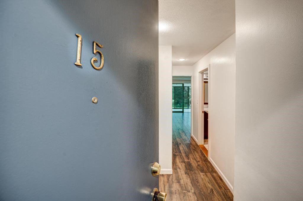 376 Great Road, Unit 15 Acton, MA 01720 - Photo 23 of 27 a view of a hallway with wooden floor